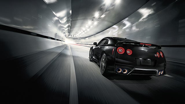 2023 Nissan GT-R seen from behind driving through a tunnel | Mathews Nissan in Paris TX